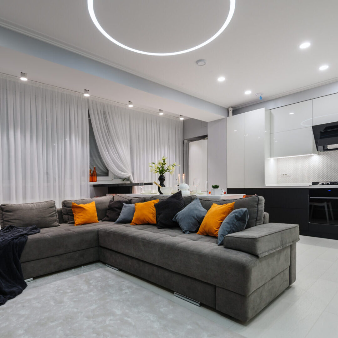 Modern designer white studio apartment, kitchen and living room toghether