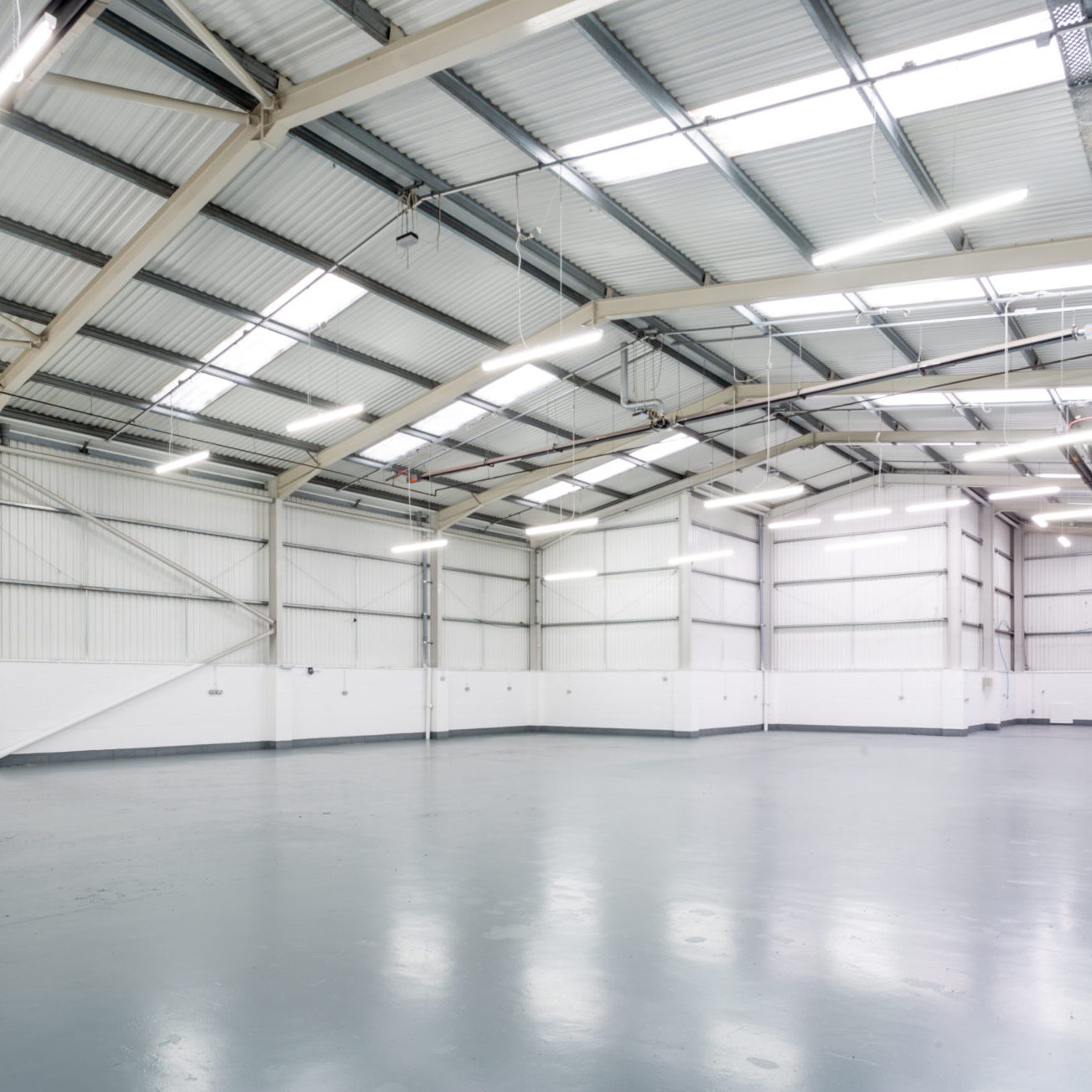 An interior of a large, empty warehouse